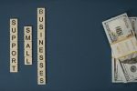 Conceptual image of supporting small businesses with financial resources using money and letter tiles.