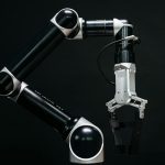 Close-up of a mechanical robotic arm with a dark background, showcasing advanced technology.