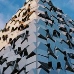Innovative geometric building exterior in Sheffield, UK basking in sunlight.