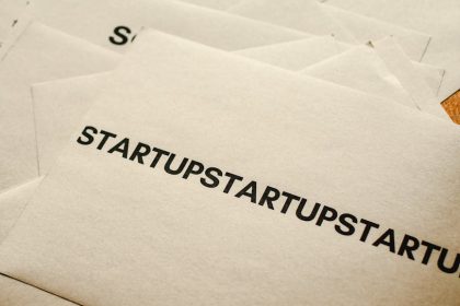 Brown paper envelopes featuring startup text, symbolizing business innovation and entrepreneurship.