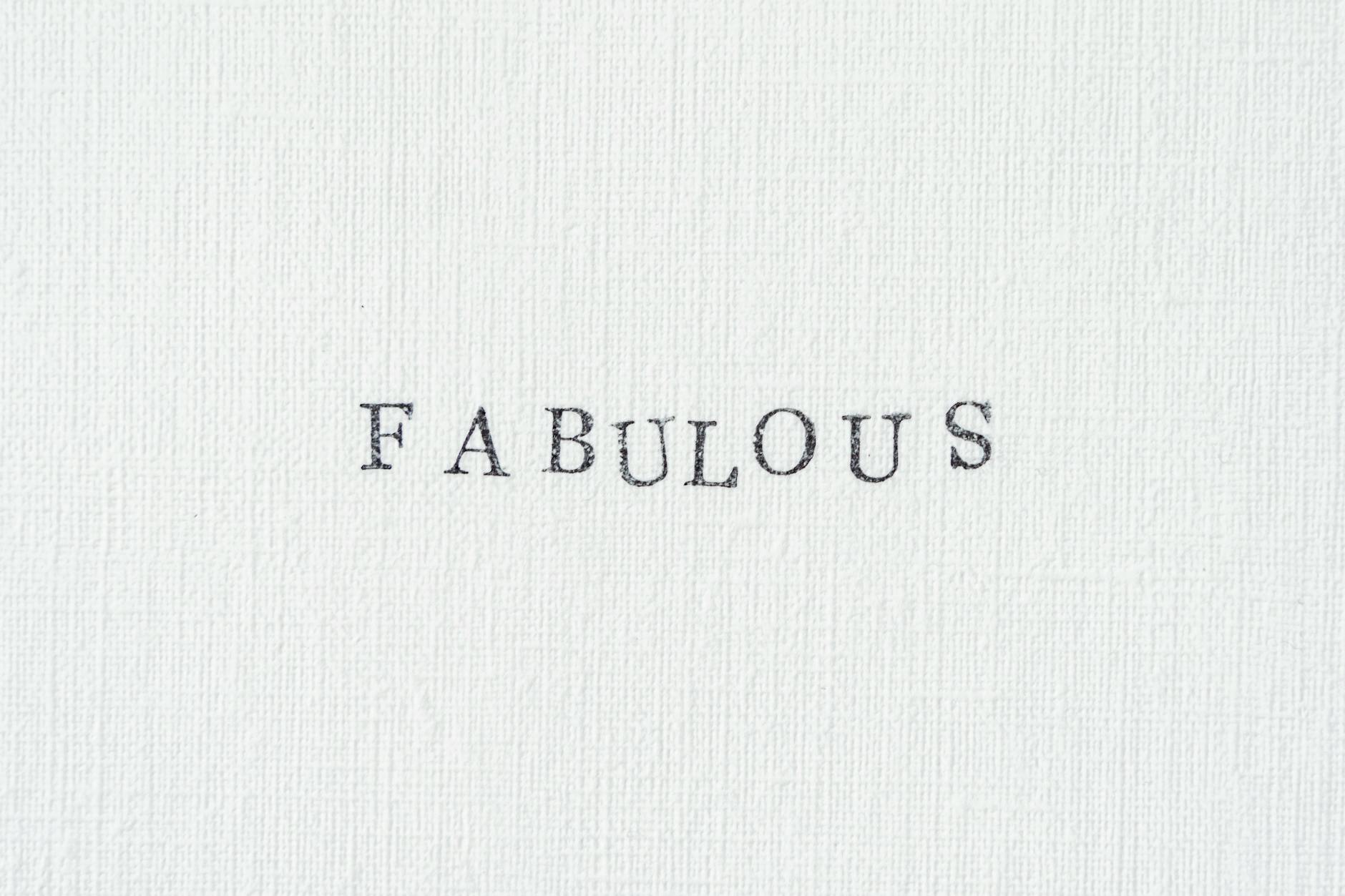 Simple textured paper featuring the word 'FABULOUS' in a clean typewriter font.