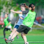 Intense soccer match between women in Hà Nội, Vietnam captured in action.