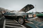 A classic vintage car with open hood displayed outdoors in São Paulo, Brazil.
