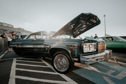A classic vintage car with open hood displayed outdoors in São Paulo, Brazil.